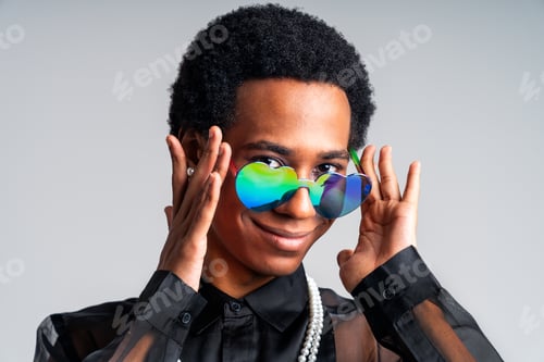 Preview: Fashionable fluid gender man posing in studio
