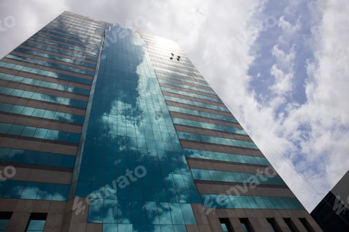 Preview: group of workers cleaning windows service on high rise building