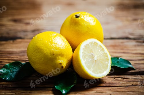 Preview: Fresh lemons. On wooden table.