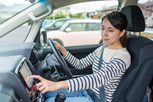 Preview: Woman driving car and using GPS system