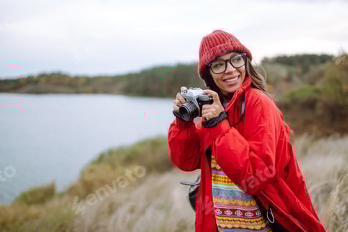 Preview: Smiling woman enjoying autumn weather. Rest, relaxation, lifestyle concept.