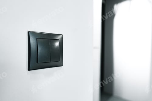 Preview: A black light switch on white wall