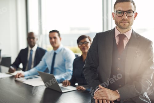 Preview: Handsome Caucasian executive with three employees