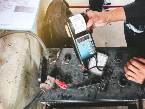 Preview: Maintenance man check power voltage of battery in the factory