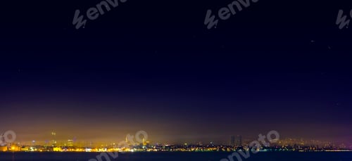 Preview: Spectacular nighttime skyline of a big modern city at night .