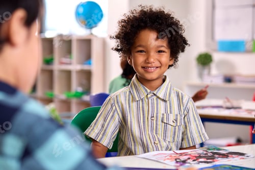 Preview: Classroom Portrait Of Smiling Male Elementary School Pupil In Art Class At School
