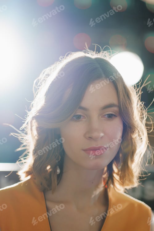 Preview: Portrait of dreamy pretty girl with natural makeup with backlight