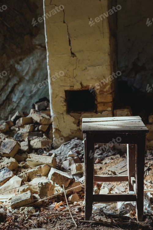Preview: abandoned building with broken brick wall and wooden dirty chair