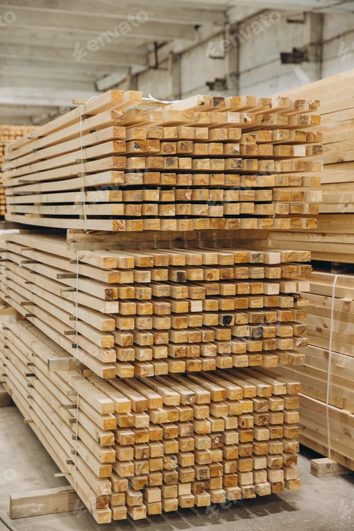 Preview: Stacks of square timber planks forming geometric pattern in lumber warehouse