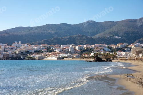 Preview: Andros island, Neimporio Beach at Chora town, Cyclades Greece. Sandy cosmopolitan beach, sea, sky.