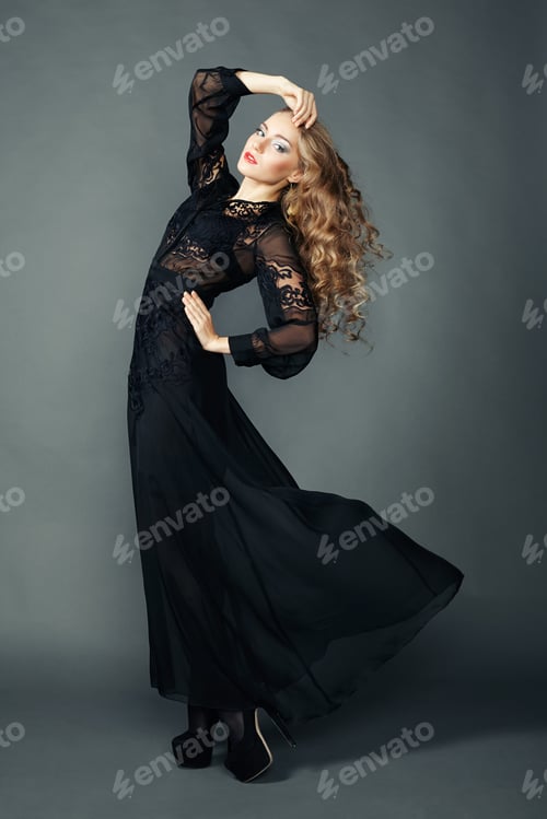 Preview: Portrait of beautiful brunette woman in black dress