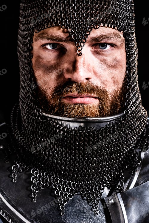 Preview: handsome knight in armor looking at camera isolated on black