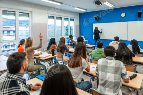 Preview: Students raising hand and following lesson in university classroom
