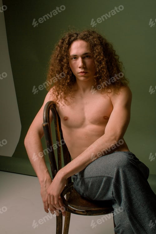 Preview: Attractive And Stylish Guy With Curly Hair And A Sports Figure