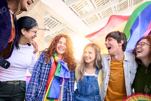 Preview: Group of excited young friends enjoying together on gay pride day. Joyful people gathered lgbti.