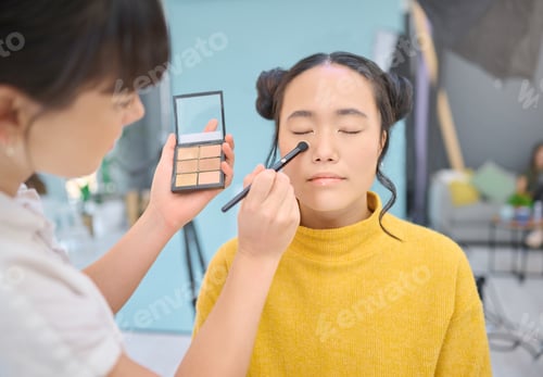 Preview: Makeup, artist and woman in studio with professional, cosmetics and creative, product and glamour.