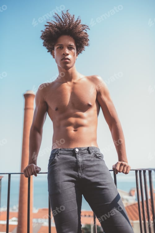 Preview: shirtless young black man on the stairs