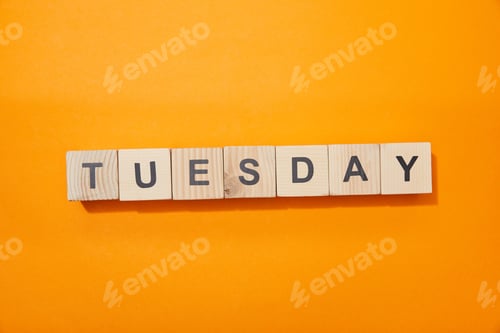 Preview: top view of wooden blocks with letters on orange surface