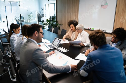 Preview: Group of multiethnic business people working at busy modern office
