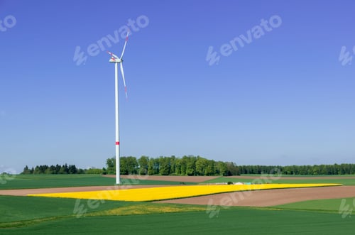 Preview: Huge windmill spinning in the field on blue sky background in Southern Germany