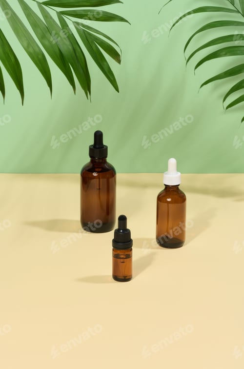 Preview: Glass bottles for cosmetics, oils with a pipette on a beige background