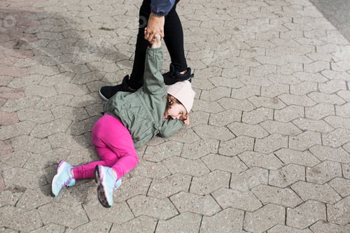 Preview: Mother dragging her crying daughter on sidewalk