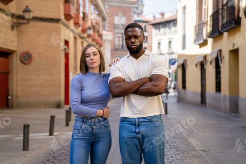 Preview: Multiethnic couple posing in a city street