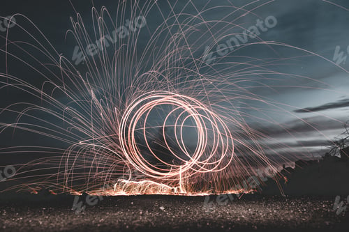 Preview: Abstract rounds above land at night
