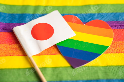 Preview: Japan flag on rainbow background symbol of LGBT gay pride month social movement rainbow flag