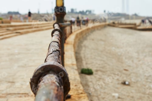 Preview: A fence surrounding the former racetrack at Caesarea Maritima National Park