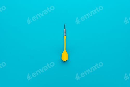 Preview: Minimalist Photo of Yellow Plastic Dart with Metal Tip on Blue Background