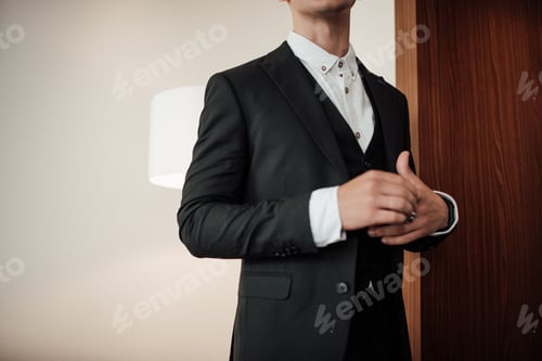 Preview: Portrait of authentic candid brunette man in business black suit