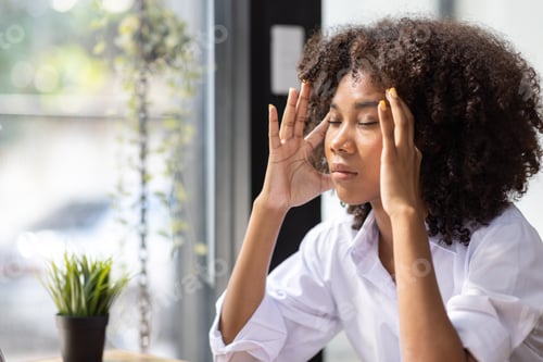 Preview: Portrait of tired young business african american woman work with documents tax laptop computer in