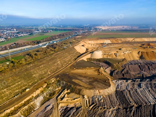 Preview: Mining equipment in a brown coal open pit mine near Garzweiler, Germany. Aerial View
