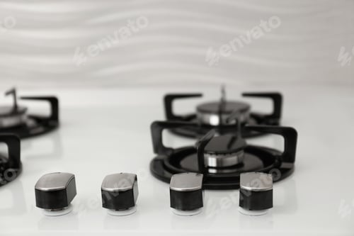 Preview: Modern built-in gas cooktop, closeup. Kitchen appliance