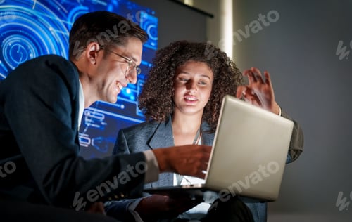 Preview: Professionals discussing data analysis in a modern office setting during the daytime