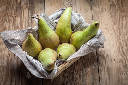 Preview: Fresh pears in a box on wooden background.