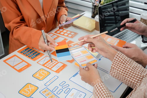 Preview: Creative Team Collaborates on UX UI Design Concepts with Wireframes and Prototypes in Modern Office