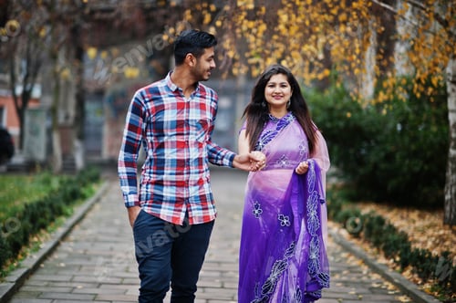 Preview: Stylish indian hindu couple posed on street.