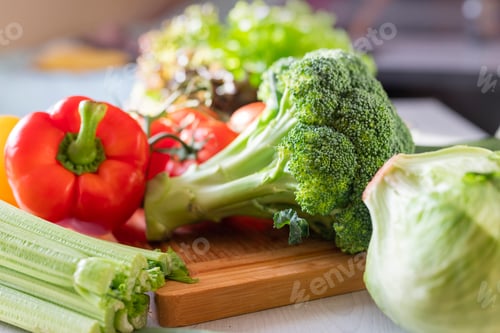 Preview: fresh vegetables for iceberg salad with paprika with cabbage broccoli tomatoes and celery