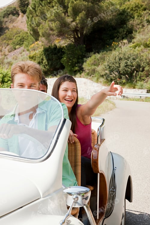 Preview: Young people driving convertible car