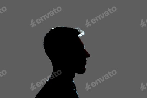 Preview: a isolated dark male silhouette in the shadow, studio portrait