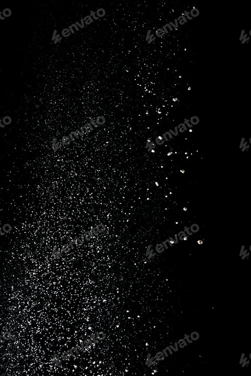 Preview: White powder splash isolated on black background. Flour sifting on a black background