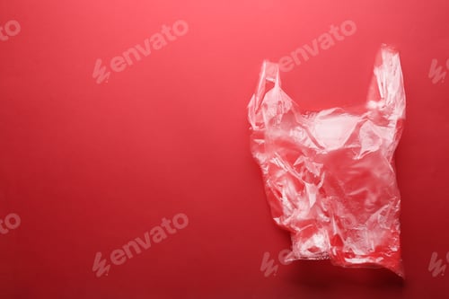 Preview: Clear disposable plastic bag on color background. Space for text