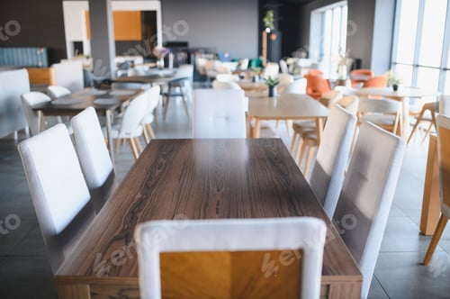 Preview: Furniture store showroom displaying elegant dining tables and chairs