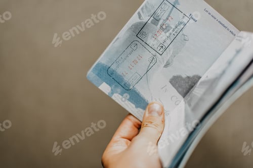 Preview: Hand holding a passport