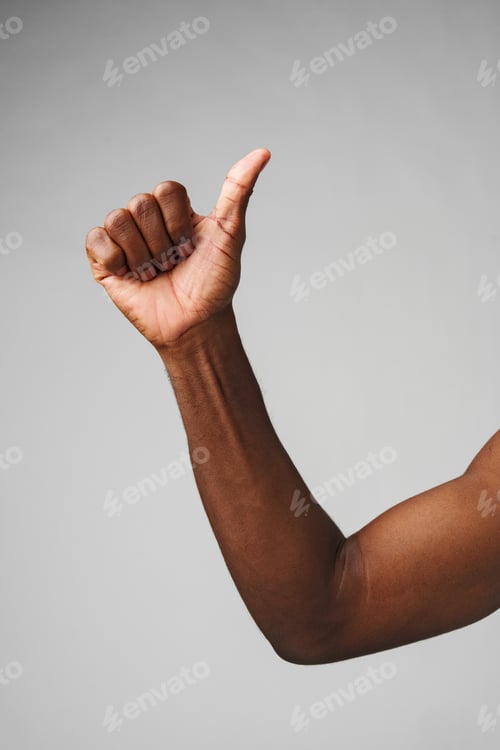 Preview: Man in White Shirt Pointing at Something on gray background