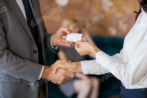 Preview: Business colleagues exchanging business card