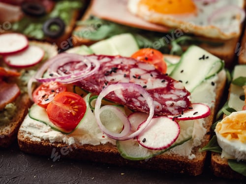 Preview: sandwiches with salami, vegetables and black sesame