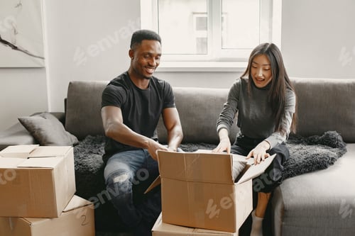 Preview: Couple unpacking boxes at their new home